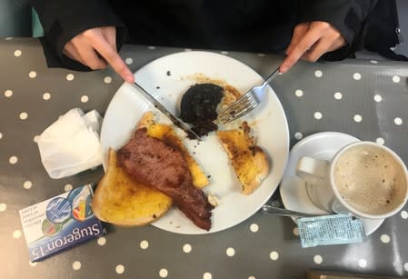 Sea sickness tablets are seen on the table of a cafe as Reuters journalist Mari Saito eats a fried breakfast in Ilfracombe