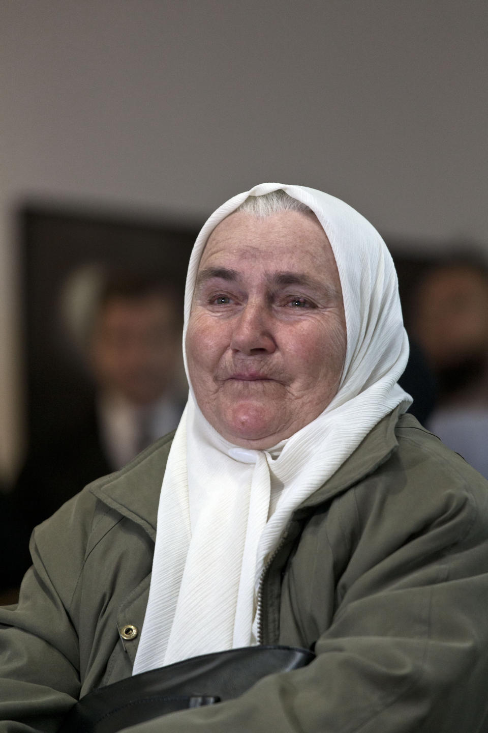 A relative of victims of the Srebrenica genocide cries as she hears the news on the decision of the UN appeals judges on former Bosnian Serb leader Radovan Karadzic in Potocari, Bosnia and Herzegovina, Wednesday, March 20, 2019. United Nations appeals judges on Wednesday upheld the convictions of Karadzic for genocide, war crimes and crimes against humanity, and increased his sentence from 40 years to life imprisonment. (AP Photo/Marko Drobnjakovic)