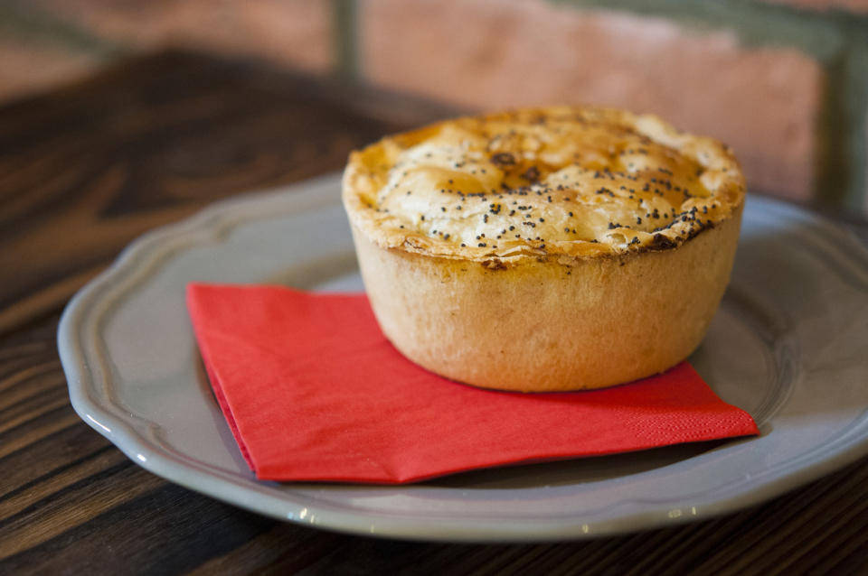 A meat pie on a plate.