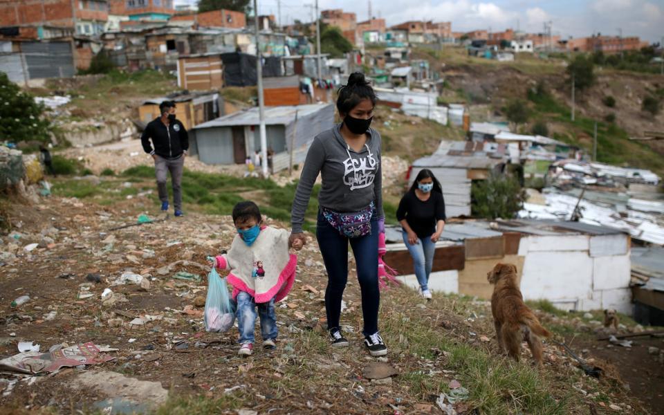 Many Colombians live under fear of militias who control rural pockets of land vacated by the Farc - LUISA GONZALEZ/REUTERS