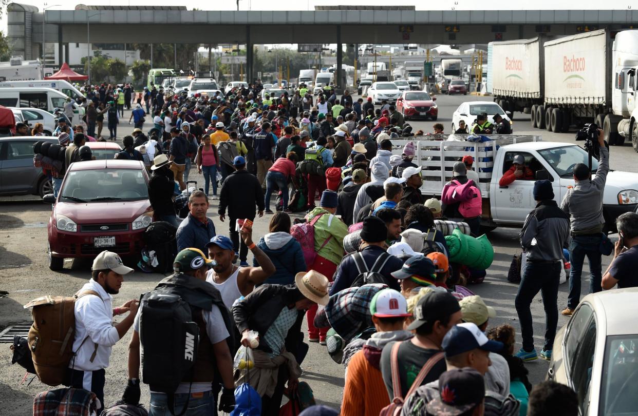 Some of the migrants from poor Central American countries -mostly Hondurans- move towards the US in hopes of seeking asylum as Donald Trump issues an order limiting it: ALFREDO ESTRELLA/AFP/Getty Images