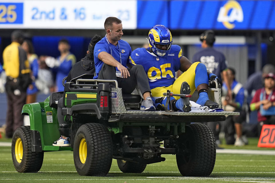 Los Angeles Rams defensive tackle Bobby Brown III is carted off the field after being inured during the second half of an NFL football game against the Philadelphia Eagles Sunday, Oct. 8, 2023, in Inglewood, Calif. (AP Photo/Gregory Bull)