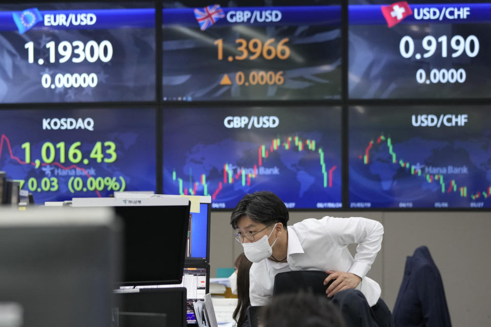 A currency trader watches monitors at the foreign exchange dealing room of the KEB Hana Bank headquarters in Seoul, South Korea, Thursday, June 24, 2021. Shares were mostly higher in Asia on Thursday after a listless day of trading on Wall Street as the recent bout of nerves over Federal Reserve policy fades. (AP Photo/Ahn Young-joon)