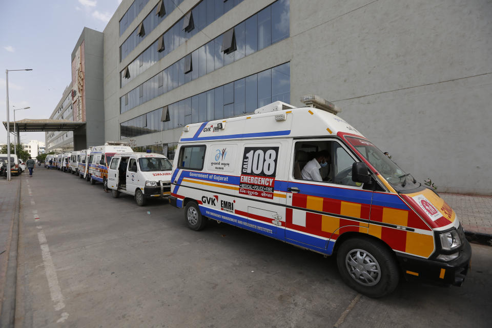 Ambulances carrying COVID-19 patients queue up waiting for their turn to be attended at a dedicated COVID-19 government hospital in Ahmedabad, India on April 17, 2021. (Ajit Solanki/AP)