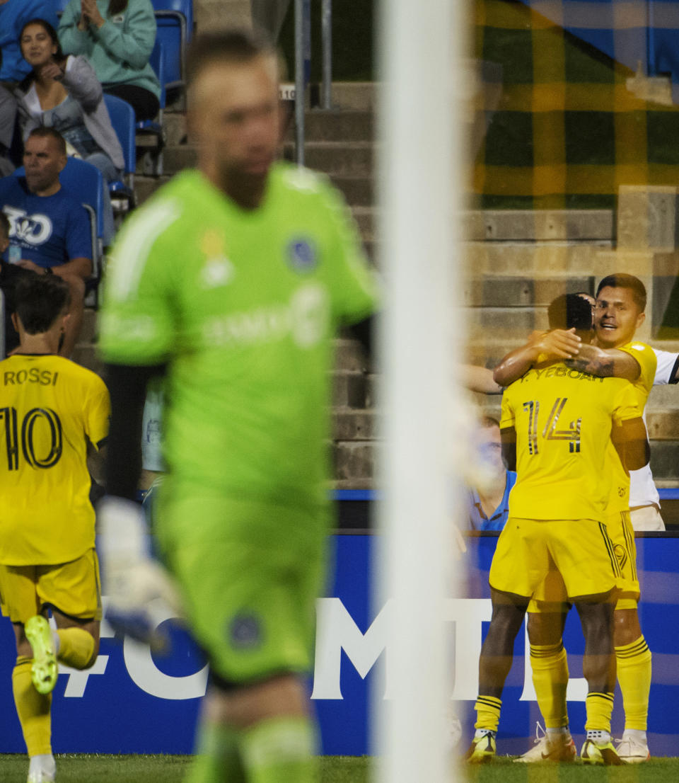 Columbus Crew's Cucho Hernandez, right, celebrates with teammates after scoring on CF Montreal goalkeeper Jonathan Sirois, foreground, during the first half of an MLS soccer match Saturday, Sept. 2, 2023, in Montreal. (Peter McCabe/The Canadian Press via AP)