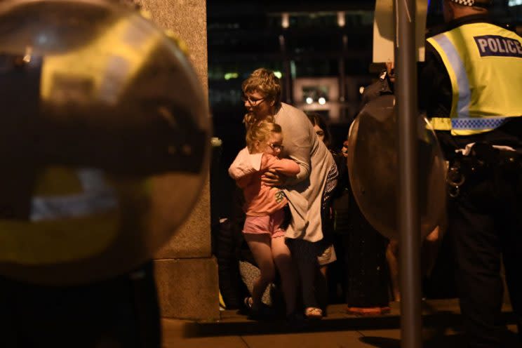 People took shelter at London Bridge. (Photo by Carl Court/Getty Images)