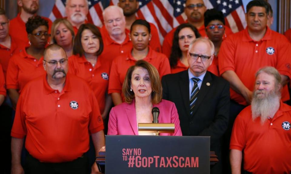 Nancy Pelosi with members of the Machinists Union International campaigning against the Republicans’ tax cut legislation this week.