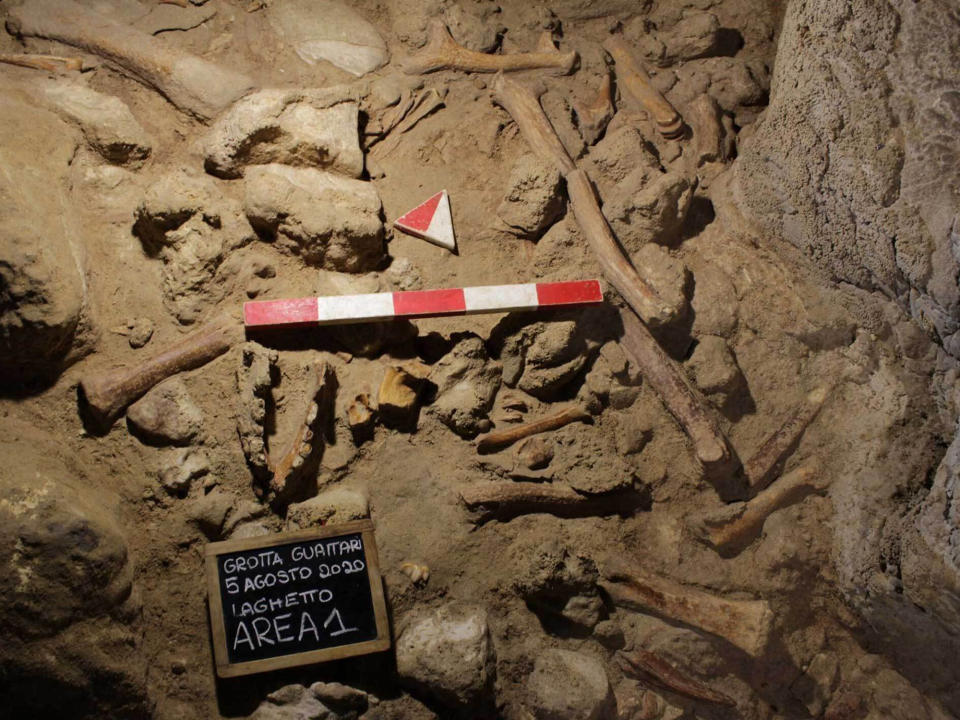 This image released by the Italian Culture Ministry shows a cave near Rome where fossil findings were discovered, shedding new light on how the Italian peninsula was populated and under what environmental conditions. The Italian Culture Ministry announced the discovery Saturday, May 8, 2021, saying it confirmed that the Guattari Cave in San Felice Circeo, where a Neanderthal skull was discovered in 1939, was “one of the most significant places in the world for the history of Neanderthals.” (Emanuele Antonio Minerva/Italian Culture Ministry via AP)