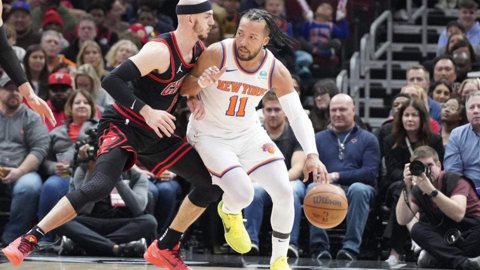 Apr 5, 2024; Chicago, Illinois, USA; Chicago Bulls guard Alex Caruso (6) defends New York Knicks guard Jalen Brunson (11) during the first quarter at United Center.