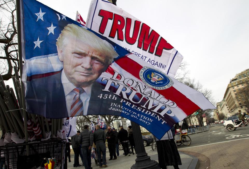 Flags with the image of President-elect Donald Trump are displayed for sale on Pennsylvania Avenue in Washington, Thursday, Jan. 19, 2017, ahead of Friday's inauguration. ( AP Photo/Jose Luis Magana)