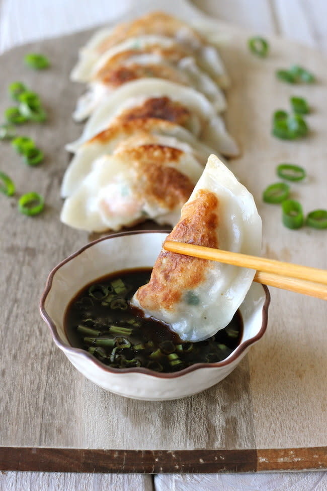 Homemade shrimp dumplings and soy sauce.