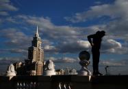 Grigory Shukhov of Rudex team stands on a parapet of a rooftop in Moscow, Russia, May 13, 2017. REUTERS/Maxim Shemetov