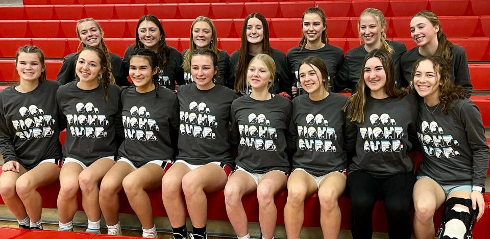 Members of the Honesdale girls varsity basketball team sporting their "Go. Fight. Cure." t-shirts on game night. The Lady Hornets helped raise funds and awareness for middle schooler Leo Nichols' battle with brain cancer.