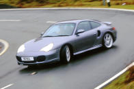 <p>Our millennial victor proved there was a place for the Turbo in the 911 line-up, displaying searing pace with a playful edge. It got even better on soaking wet Tarmac, where it lapped faster and more securely than even rally-honed machines such as the <strong>Subaru Impreza P1</strong>. Expect to pay around <strong>£50,000</strong> for a tidy example now.</p><p><span>And now for the </span><strong>sports cars</strong><strong>...</strong></p>