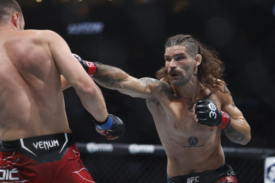 Jul 29, 2023; Salt Lake City, Utah, USA; Matthew Semelsberger (red gloves) fights Uros Medic (blue gloves) during UFC 291 at Delta Center. Mandatory Credit: Jeff Swinger-USA TODAY Sports