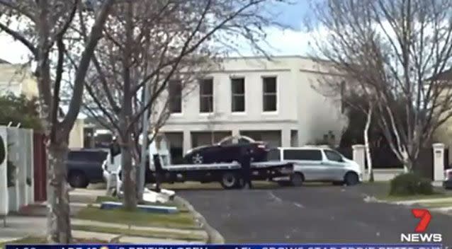 Police have removed a black Mercedes from the home of Karen Ristevski's husband. Photo: 7 News