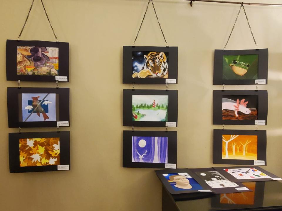 Artwork from the 2022 Art in April event is shown.