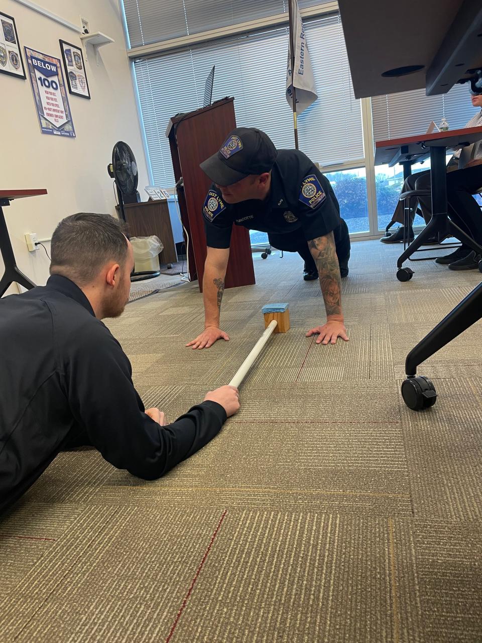 East Lyme Officer William Turcotte demonstrates proper push-up technique at a Law Enforcement Council of Connecticut seminar in Norwich on Saturday.