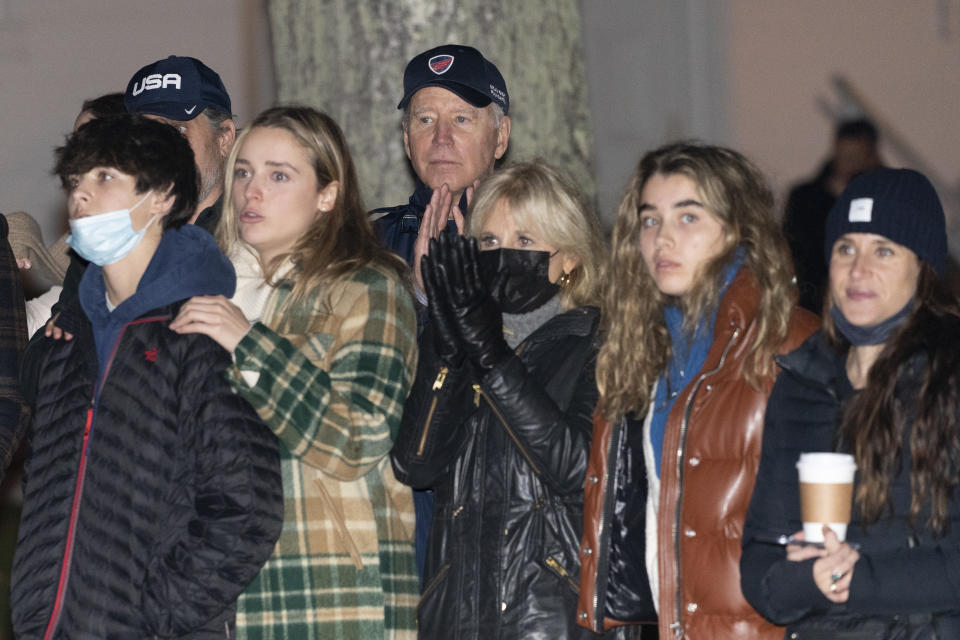 President Joe Biden, first lady Jill Biden and members of the Biden family watch the annual Christmas Tree Lighting ceremony at the top of Maine Street in Nantucket, Mass., Friday, Nov. 26, 2021. (AP Photo/Carolyn Kaster)