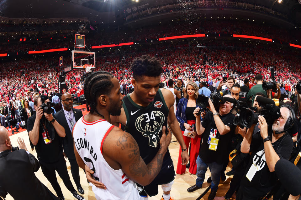 Kawhi Leonard #2 of the Toronto Raptors and Giannis Antetokounmpo #34 of the Milwaukee Bucks hug after Game 6 of the Eastern Conference Finals on May 25, 2019 at Scotiabank Arena in Toronto. (Photo by Jesse D. Garrabrant/NBAE via Getty Images)