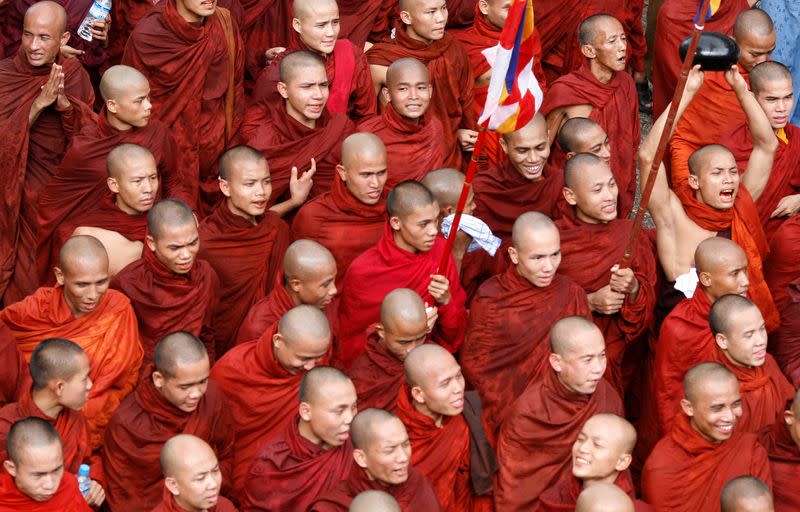 FILE PHOTO: Monks march through Yangon city centre in an anti-government demonstration