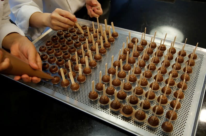 FILE PHOTO: Empoyees of chocolate and cocoa product maker Barry Callebaut prepare chocolates in Zurich