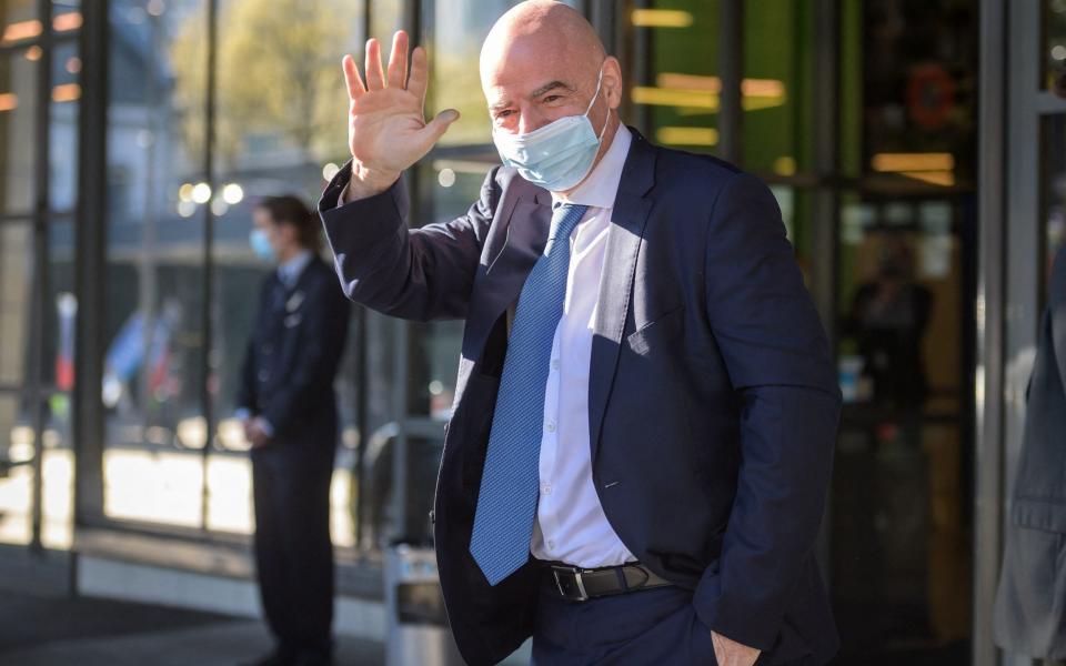 FIFA president Gianni Infantino waves as he arrives for a Uefa congress - FABRICE COFFRINI /AFP