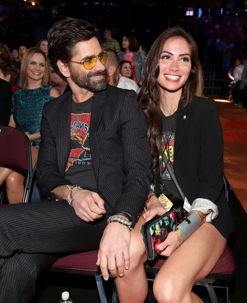 <p>Stamos, who began dating McHugh in 2015, couldn’t take his eyes off her at the 2017 Kids’ Choice Awards. (Photo: Chris Polk/KCA2017/Getty Images for Nickelodeon) </p>