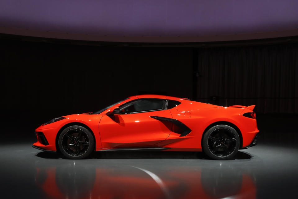 This June 24, 2019, photo shows a pre-production 2020 Chevrolet Corvette automobile in Warren, Mich. The mid-engine C8, the flagship of GM's Chevrolet brand, will have the weight balance and center of gravity of a race car, rivaling European counterparts and leaving behind sports sedans and ever-more-powerful muscle cars that were getting close to outperforming the current 'Vette. (AP Photo/Paul Sancya)