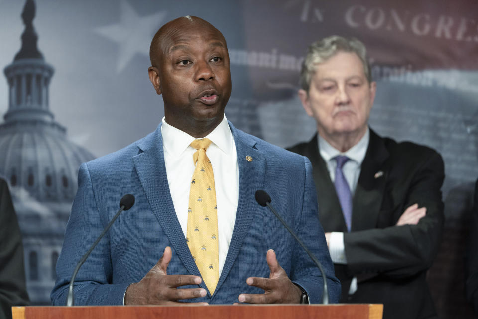 FILE - Sen. Tim Scott, R-S.C., left, speaks during a news conference, Oct. 19, 2021, next to Sen. John Kennedy, R-La., on Capitol Hill in Washington. The U.S. Senate’s only Black Republican is putting forth what he characterizes as a positive response to partisan rhetoric on race that he’s best-positioned to rebut. Tim Scott of South Carolina tells The Associated Press that he hopes a video series on issues he sees as pertinent to the Black community will help refocus a fraught national conversation on race. Scott has timed the release in conjunction with Martin Luther King Jr. Day. (AP Photo/Jacquelyn Martin, File)