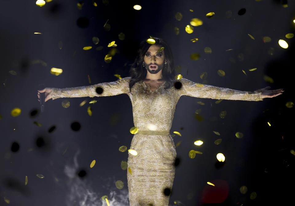 File - Singer Conchita Wurst representing Austria performs the song 'Rise Like a Phoenix' after winning the Eurovision Song Contest in the B&W Halls in Copenhagen, Denmark, May 10, 2014. Since 1956, the Eurovision Song Contest has provided catchy tunes, cheesy pop and bombastic anthems - but also some eye-catching fashion. (AP Photo/Frank Augstein, File)