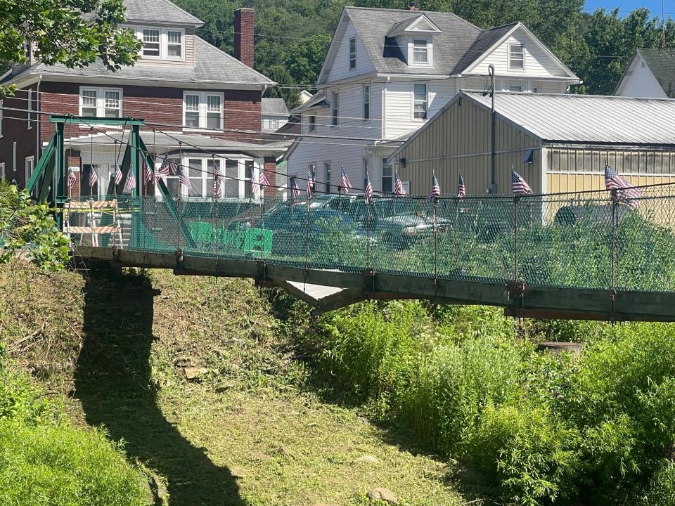 The pedestrian suspension bridge in Hooversville is closed because a section of the footbridge has collapsed.