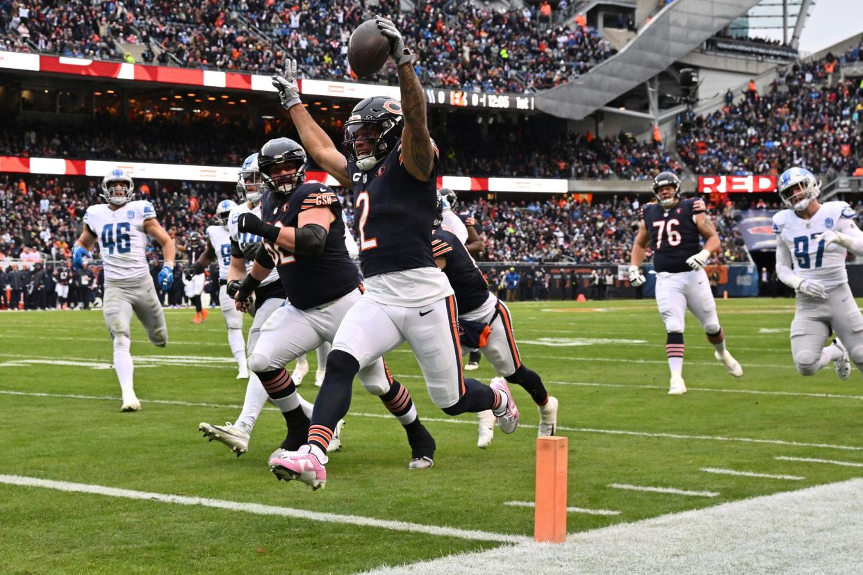 Bears wide receiver DJ Moore scores a touchdown on a 16-yard run in the first half on Sunday, Dec. 10, 2023, in Chicago.