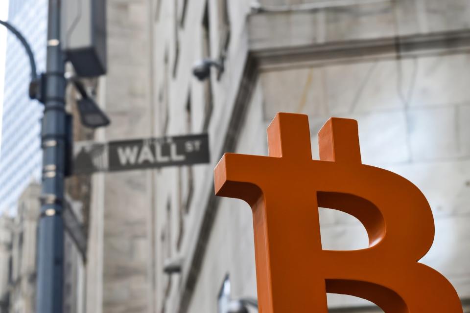 Bitcoin symbol on Wall Street. 