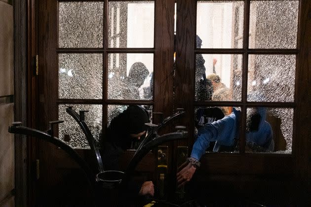 Student protesters block the entrance of Hamilton Hall at Columbia University after taking over it on Tuesday, April 30, 2024 in New York.