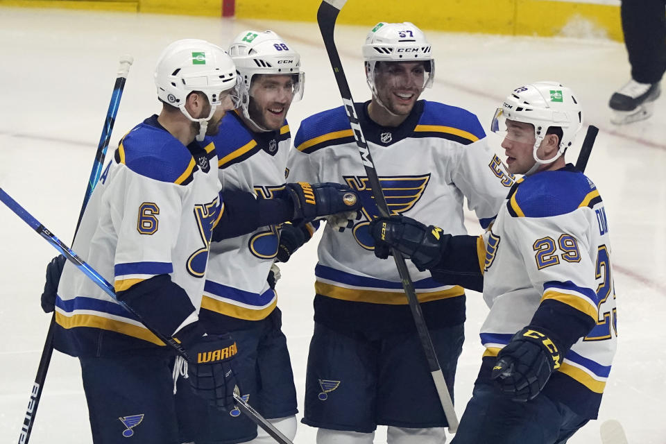 St. Louis Blues left wing David Perron, second from right, celebrates his goal with teammates during the first period of an NHL hockey game against the Los Angeles Kings, Saturday, March 6, 2021, in Los Angeles. (AP Photo/Marcio Jose Sanchez)