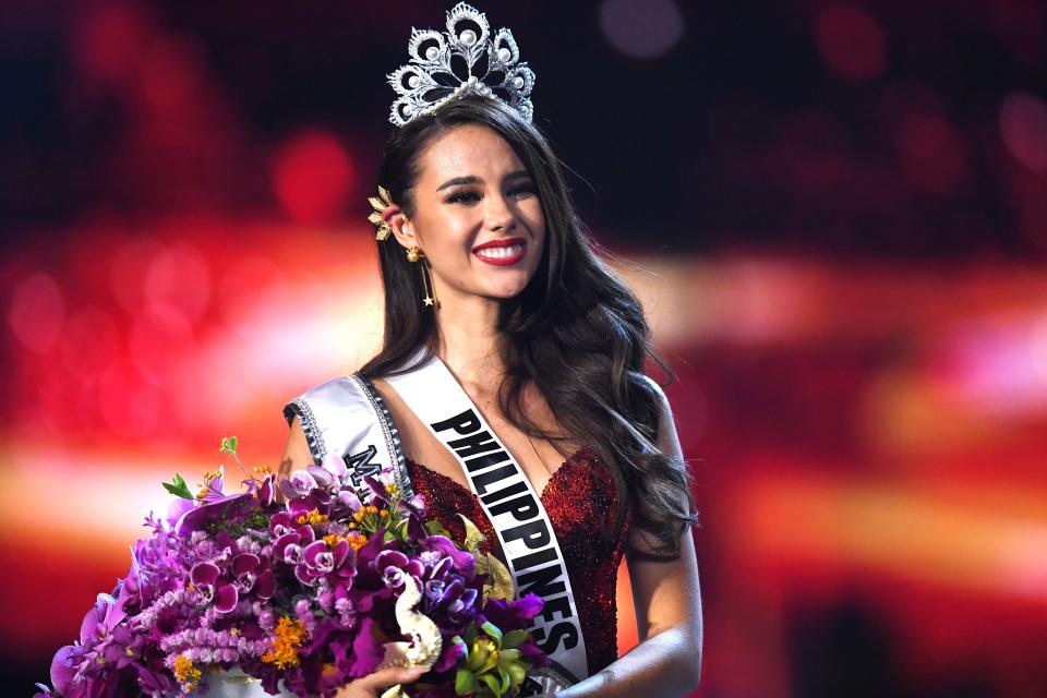 Catriona Gray of the Philippines smiles after being crowned Miss Universe 2018 on Dec. 17 in Bangkok. (Photo: LILLIAN SUWANRUMPHA/AFP/Getty Images)