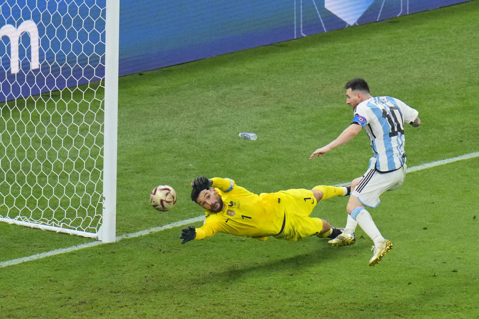 Argentina's Lionel Messi scores his side's 3rd goal during the World Cup final soccer match between Argentina and France at the Lusail Stadium in Lusail, Qatar, Sunday, Dec. 18, 2022. (AP Photo/Hassan Ammar)