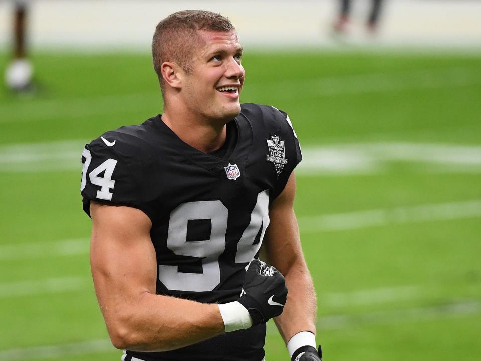 Carl Nassib on the field, flexing arm