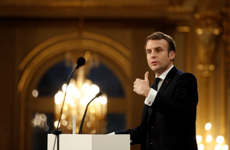 French President Emmanuel Macron delivers his New Year wishes to the press at the Elysee Palace in Paris