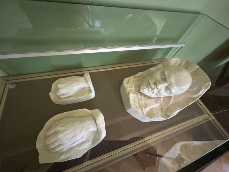Casts of Lenin's death mask and his hands can be seen in a display case in the room of the Gorki Leninskiye museum complex not far from Moscow. Ulf Mauder/dpa