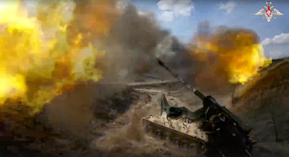 FILE - In this photo taken from video released by the Russian Defense Ministry Press Service on May 18, 2023, a Russian 152 mm self-propelled gun fires toward Ukrainian position at an undisclosed location. As the Kremlin watches for more signs of crumbling Western support for Ukraine, the Russian military has pressed attacks in several sectors in a bid to drain Kyiv's reserves and deplete its munitions. (Russian Defense Ministry Press Service via AP, File)