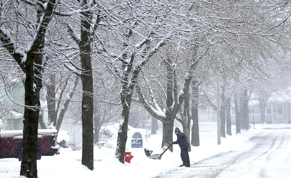 Armin Koep uses a snowblower to clear his driveway on Buena Vista Avenue as the snow falls Wednesday morning, Jan. 25, 2023. TOM E. PUSKAR/ASHLAND TIMES-GAZETTE