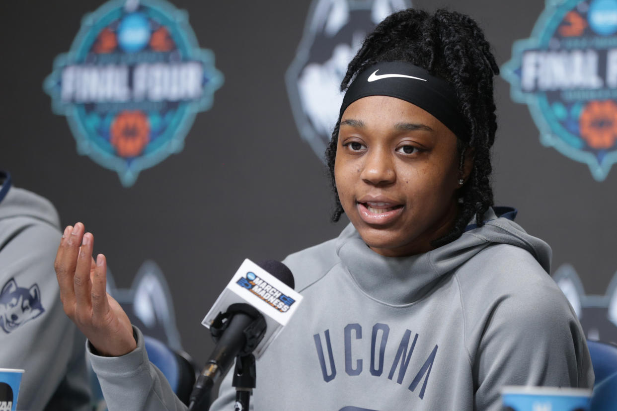 MINNEAPOLIS, MN - MARCH 31: Christyn Williams #13 of the Connecticut Huskies answers questions during a press conference at the 2022 NCAA Women's Basketball Final Four at the Target Center on March 31, 2022 in Minneapolis, Minnesota. (Photo by Evert Nelson/NCAA Photos via Getty Images)