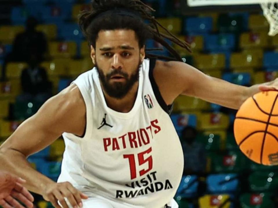 Rapper J Cole, born Jermaine Cole, seen playing for the Rwanda-based Patriots BBC during a Basketball Africa League game in 2021. (Getty Images - image credit)