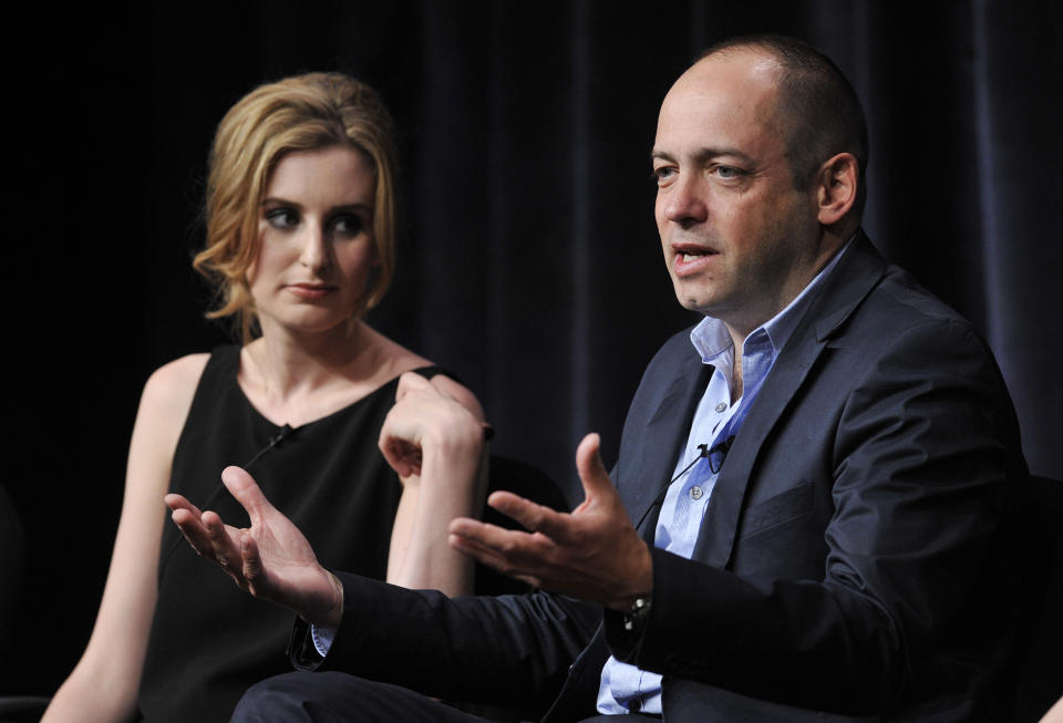 Gareth Neame, right, executive producer of the Masterpiece series "Downton Abbey," addresses a reporter as cast member Laura Carmichael looks on during the PBS Summer 2013 TCA press tour at the Beverly Hilton Hotel on Tuesday, Aug. 6, 2013 in Beverly Hills, Calif. (Photo by Chris Pizzello/Invision/AP)