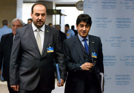 Syria's main opposition High Negotiations Committee, HNC, leader Nasr al-Hariri (L) and member of Syrian opposition delegation, Mohamad Sabra, arrive for a meeting with UN Special Envoy during in Geneva, Switzerland, February 27, 2017. REUTERS/ Fabrice Coffrini/Pool