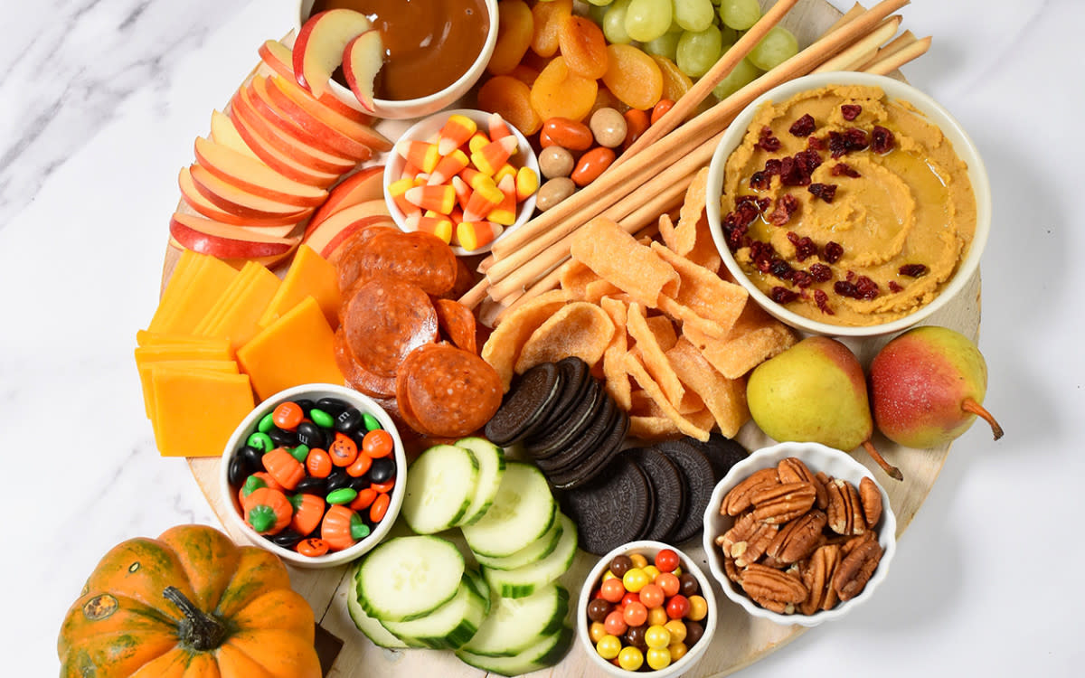 <p>Teresa Blackburn</p><p>Loaded up with fruit, veggies, crackers or chips, and a sweet-and-savory Pumpkin-Spice Hummus recipe, this board makes a great <a href="https://parade.com/844676/felicialim/21-last-minute-thanksgiving-appetizers-to-serve/" rel="nofollow noopener" target="_blank" data-ylk="slk:Thanksgiving appetizer;elm:context_link;itc:0;sec:content-canvas" class="link rapid-noclick-resp">Thanksgiving appetizer</a> with dried cranberries sprinkled on the dip before serving.</p><p><strong>Get the recipe: </strong><strong><a href="https://parade.com/1274566/parade/halloween-charcuterie-board-and-pumpkin-spice-hummus/" rel="nofollow noopener" target="_blank" data-ylk="slk:Pumpkin Spice Hummus Charcuterie Board;elm:context_link;itc:0;sec:content-canvas" class="link rapid-noclick-resp">Pumpkin Spice Hummus Charcuterie Board</a></strong></p>