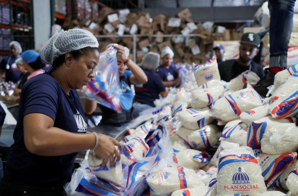<p>Workers of the Social State Plan prepare food rations in preparation for Hurricane Fiona, in Santo Domingo, Dominican Republic, September 18, 2022. REUTERS/Ricardo Rojas</p> 
