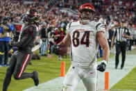 Cincinnati Bengals tight end Mitchell Wilcox (84) scores a touchdown against the Tampa Bay Buccaneers during the second half of an NFL football game, Sunday, Dec. 18, 2022, in Tampa, Fla. (AP Photo/Chris O'Meara)
